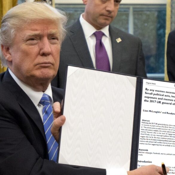 Meme: Donald Trump holding a photoshoped copy of our meme paper.
